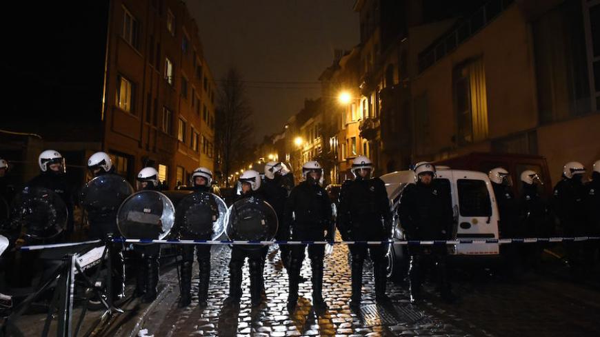 Belgian police forces stand guard in a street during a police action in the Molenbeek-Saint-Jean district in Brussels, on March 18, 2016. A police operation was underway on March 18, in the Brussels area home to key Paris attacks suspect Salah Abdeslam whose fingerprints were found in an apartment raided this week, the federal prosecutor's office said. AFP PHOTO / JOHN THYS / AFP / JOHN THYS (Photo credit should read JOHN THYS/AFP/Getty Images)