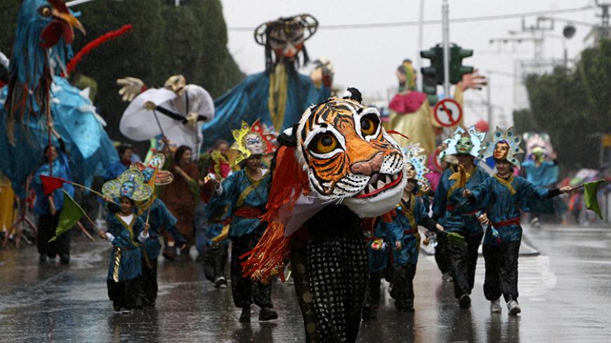 Children take part in a parade celebrating the Jewish holiday of Purim in the Israeli city of Holon, near Tel Aviv, March 1, 2010. Purim is a celebration of the Jews' salvation from genocide in ancient Persia, as recounted in the Book of Esther. REUTERS/Ronen Zvulun (ISRAEL - Tags: RELIGION SOCIETY IMAGES OF THE DAY) - RTR2B3C8