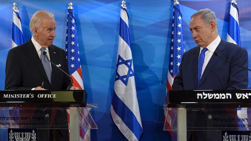 U.S. Vice President Joe Biden (L) and Israeli Prime Minister Benjamin Netanyahu look at each other as they deliver joint statements during their meeting in Jerusalem March 9, 2016. REUTERS/Debbie Hill/Pool      TPX IMAGES OF THE DAY      - RTS9ZRL