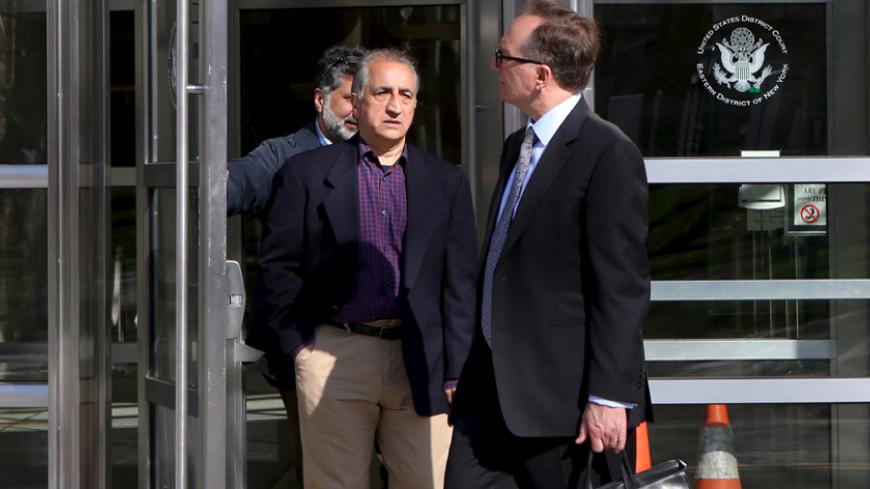 Ahmad Sheikhzadeh (C), a consultant to the Iranian mission to the United Nation, leaves Brooklyn Federal Court in New York, March 23, 2016. Sheikhzadeh, 60, is accused of charges related to sanctions violations, money laundering and tax matters, his lawyer Steve Zissou said at the hearing. REUTERS/Pearl Gabel - RTSBYWL