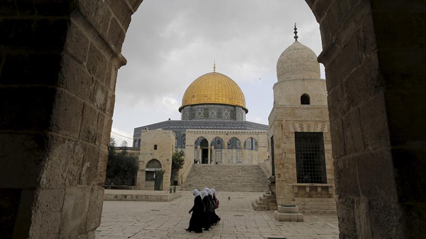 People walk near the Dome of the Rock on the compound known to Muslims as the Noble Sanctuary and to Jews as Temple Mount in Jerusalem's Old City October 26, 2015. Monday's visit to the compound was low-key by most standards - no fighting broke out, no one was ejected by the police, everyone left calmly and life returned to normal. But in critical ways it cut to the heart of an issue fuelling the worst violence between Palestinians and Israel in years: whether the status quo at the site, also known as the A