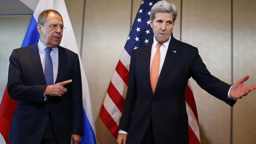 U.S. Foreign Secretary John Kerry and Russian Foreign Minister Sergei Lavrov (L) gesture before their bilateral talks in Munich, Germany, February 11, 2016, ahead of the International Syria Support Group (ISSG) meeting. REUTERS/Michael Dalder   TPX IMAGES OF THE DAY - RTX26HN2