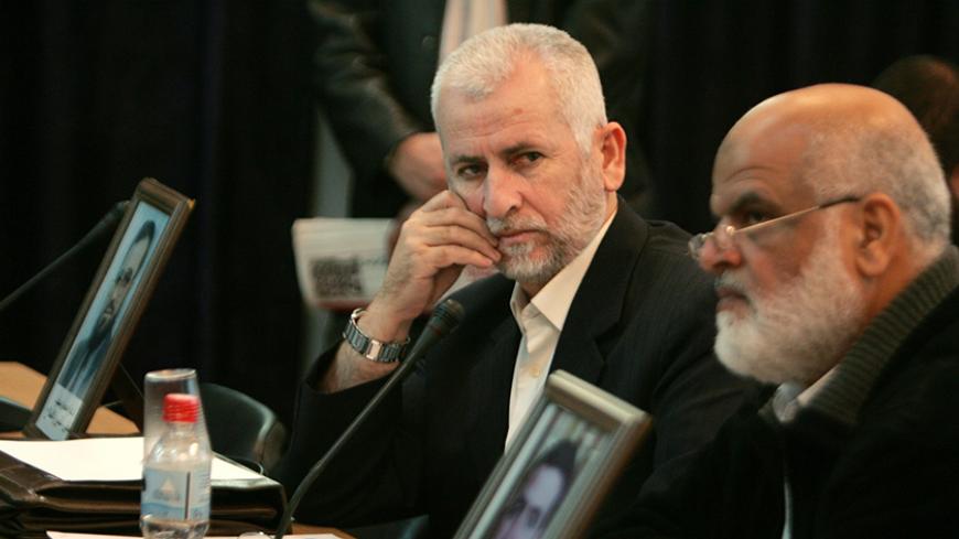 Palestinian lawmakers of Hamas attend a session of the Palestinian Legislative Council in Gaza November 21, 2007. REUTERS/Ismail Zaydah (GAZA) - RTX3UHH