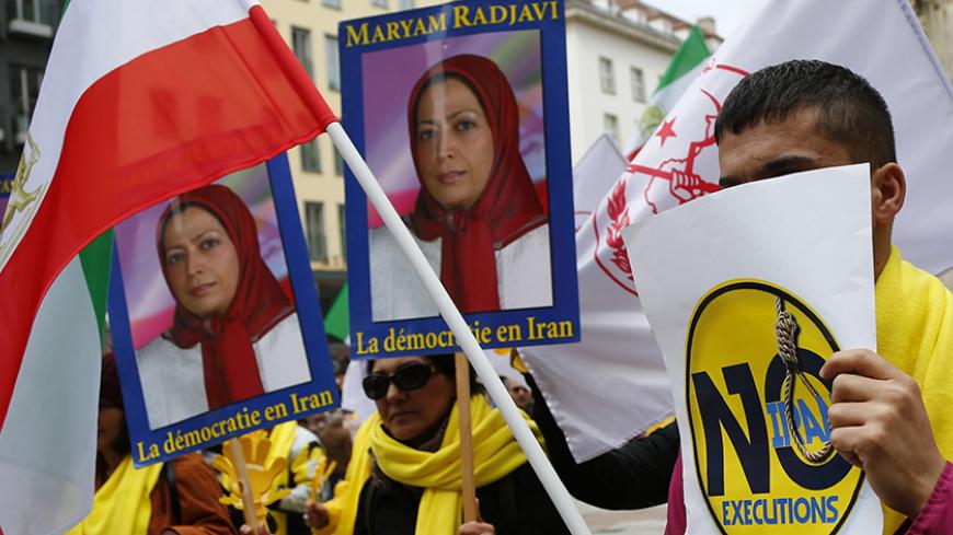 Demonstrators hold placards showing a portrait of Maryam Rajavi, President of the National Council of Resistance of Iran (NCRI), during a protest against Iran's President Hassan Rouhani in Vienna, Austria, March 30, 2016. REUTERS/Leonhard Foeger - RTSCU95