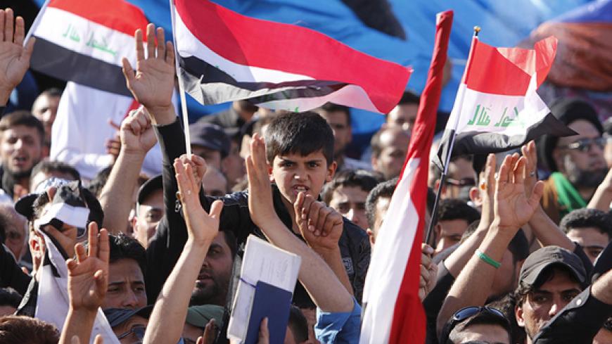 Supporters of prominent Iraqi Shi'ite cleric Moqtada al-Sadr shout slogans during a protest near the gates of Baghdad's heavily fortified Green Zone March March 31, 2016.  REUTERS/Ahmed Saad - RTSD1EC