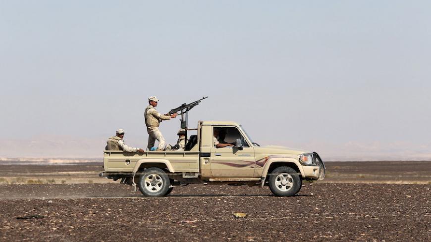 An Egyptian army vehicle guard the site where a Russian airliner crashed in the al-Hasanah area in El Arish city, north Egypt, November 1, 2015. Russia has grounded Airbus A321 jets flown by the Kogalymavia airline, Interfax news agency reported on Sunday, after one of its fleet crashed in Egypt's Sinai Peninsula, killing all 224 people on board. REUTERS/Mohamed Abd El Ghany - RTX1U8ZS