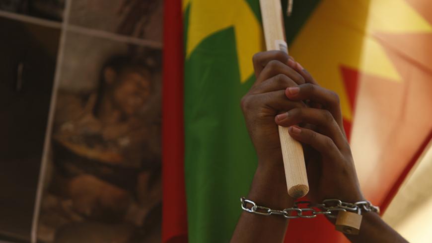 Ethiopian migrants, all members of the Oromo community of Ethiopia living in Malta, protest against the Ethiopian regime in Valletta, Malta, December 21, 2015. Protesters are calling on Malta and the European Union to stop support for the Ethiopian regime, and protested against the regime's plan to evict Oromo farmers to expand Ethiopia's capital Addis Ababa, according to the protest organisers. REUTERS/Darrin Zammit Lupi  MALTA OUT. NO COMMERCIAL OR EDITORIAL SALES IN MALTA - RTX1ZMDR