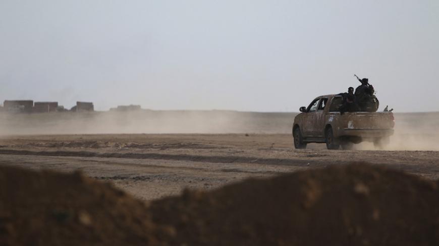 Fighters from the Democratic Forces of Syria drive to position themselves in Ghazila village after taking control of the town from Islamic State forces in the southern countryside of Hasaka, Syria February 17, 2016. Picture taken February 17, 2016. REUTERS/Rodi Said  - RTX27JLU