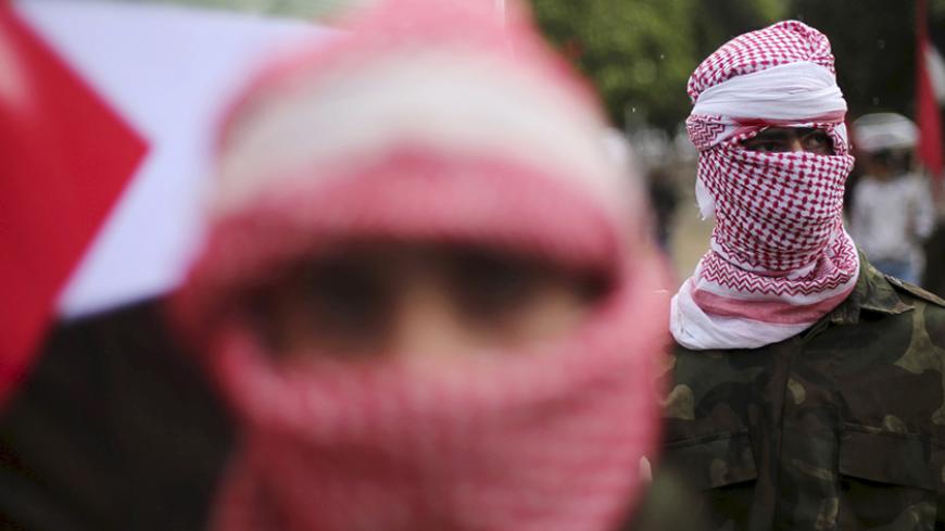 Supporters of the Popular Front for the Liberation of Palestine (PFLP) take part in a protest against the policies of Palestinian President Mahmoud Abbas, in Gaza City April 12, 2016. REUTERS/Mohammed Salem - RTX29K7J