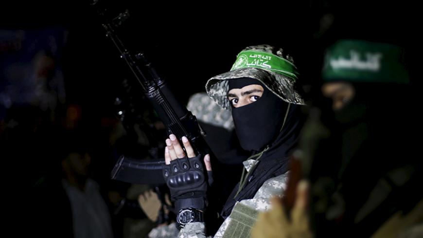 Palestinian Hamas militants take part in a rally marking Palestinian Prisoners' Day, in Gaza City April 17, 2016. REUTERS/Suhaib Salem - RTX2AD8Y