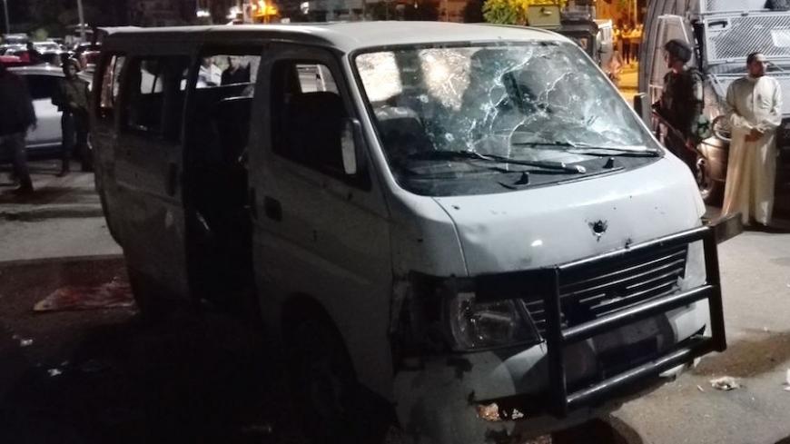 A picture taken in the early hours of May 8, 2016, shows a damaged vehicle following a gun attack on Egyptian policemen in Cairo's southern outskirts.

The interior ministry said four assailants in a truck intercepted a van carrying the policemen in the district of Helwan, just south of Cairo, and sprayed them with automatic rifle fire. It said those killed in the shooting overnight included a lieutenant and seven lower ranking policemen who had been on patrol in plain clothing. In a statement circulated on