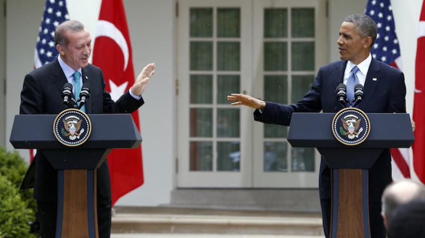 U.S. President Barack Obama (R) and Turkish Prime Minister Recep Tayyip Erdogan hold a joint news conference in the White House Rose Garden in Washington, May 16, 2013. REUTERS/Jason Reed (UNITED STATES - Tags: POLITICS) - RTXZPC4