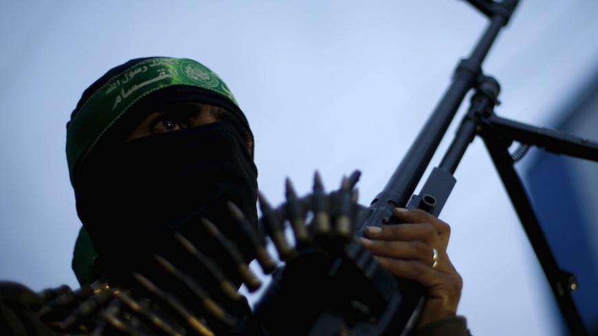A Palestinian Hamas militant takes part in a rally marking the twelfth anniversary of the death of late Hamas leader Sheikh Ahmed Yassin, who was killed in an Israeli attack in Gaza City, March 23, 2016. REUTERS/Suhaib Salem - RTSBYI2