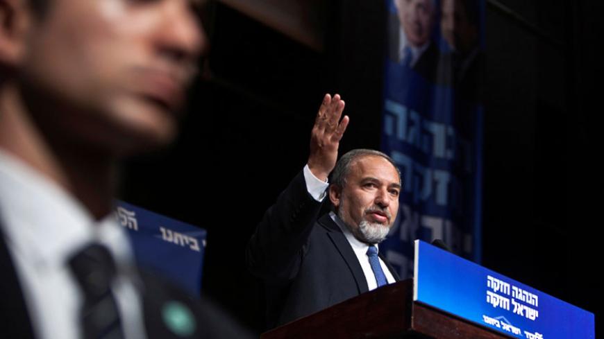 Israel's former Foreign Minister Avigdor Lieberman (R) delivers a speech during a convention at Kibbutz Shefayim north of Tel Aviv January 2, 2013. REUTERS/Nir Elias/File Photo - RTSFVZO