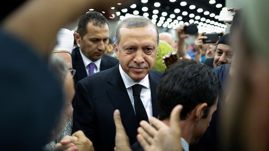 Turkish President Tayyip Erdogan arrives to take part in the jenazah, an Islamic funeral prayer, for the late boxing champion Muhammad Ali in Louisville, Kentucky, U.S. June 9, 2016. REUTERS/Adrees Latif - RTSGS76
