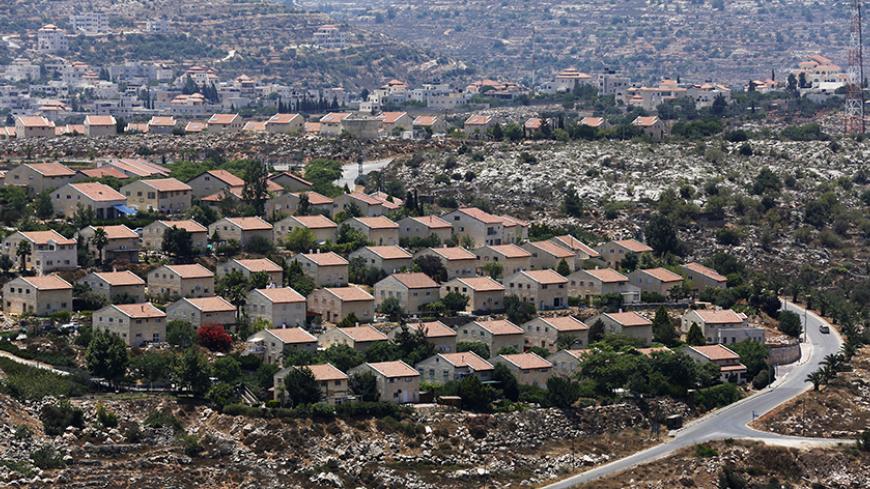 Houses are seen in the West Bank Jewish settlement of Ofra, north of Ramallah July 18, 2013. Negotiations between Israel and the Palestinians, which have ebbed and flowed for two decades, last broke down in late 2010, after a partial settlement halt meant to foster talks ended and Israeli Prime Minister Benjamin Netanyahu refused to extend it. Palestinians familiar with Palestinian President Mahmoud Abbas' thinking speculated he might now forgo the demand for a settlement moratorium given a recent slowdown