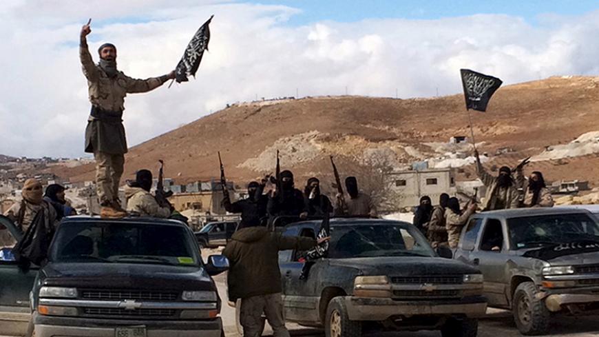 Al Qaeda-linked Nusra Front fighters carry weapons on the back of pick-up trucks during the release of Lebanese soldiers and policemen in Arsal, eastern Bekaa Valley, Lebanon, December 1, 2015.  REUTERS/Stringer      TPX IMAGES OF THE DAY      - RTX1WPTT