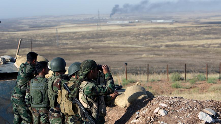 Kurdish Peshmerga forces keep watch in a village east of Mosul, Iraq, May 29, 2016.  REUTERS/Azad Lashkari - RTX2EODA