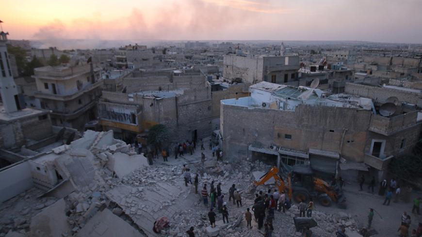 Men inspect damage after an airstrike on Aleppo's rebel held al-Hallak neighbourhood, Syria June 2, 2016. REUTERS/Abdalrhman Ismail - RTX2FEO4