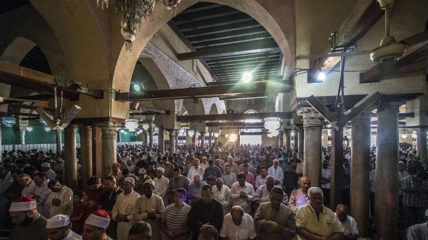 Egyptian men attend the Friday weekly prayer at al-Azhar mosque in the capital Cairo's Islamic quarter, on October 2, 2015. AFP PHOTO / KHALED DESOUKI        (Photo credit should read KHALED DESOUKI/AFP/Getty Images)