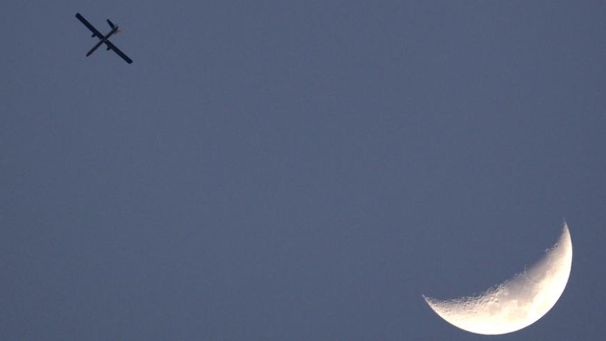 An Israeli air force drone is seen flying over Gaza as seen from the northern Gaza strip border April 9, 2011. Israel killed four Palestinian militants and wounded half a dozen others as it pursued air raids in Gaza for a third day on Saturday, responding to increased rocket fire out of the territory, local medics said.

 REUTERS/Darren Whiteside (ISRAEL - Tags: MILITARY SOCIETY IMAGES OF THE DAY) - RTR2L11O