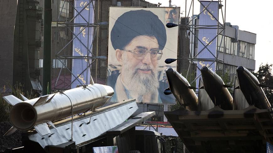 EDITORS' NOTE: Reuters and other foreign media are subject to Iranian restrictions on their ability to film or take pictures in Tehran.
Iranian-made Fateh 110 (Conqueror) (L) and Persian Gulf (R) missiles are seen next to a portrait of Iran's Supreme Leader Ayatollah Ali Khamenei at a war exhibition held by Iran's revolutionary guard to mark the anniversary of the Iran-Iraq war (1980-88), also known in Iran as the "Holy Defence", at Baharestan square near the Iranian Parliament in southern Tehran September 
