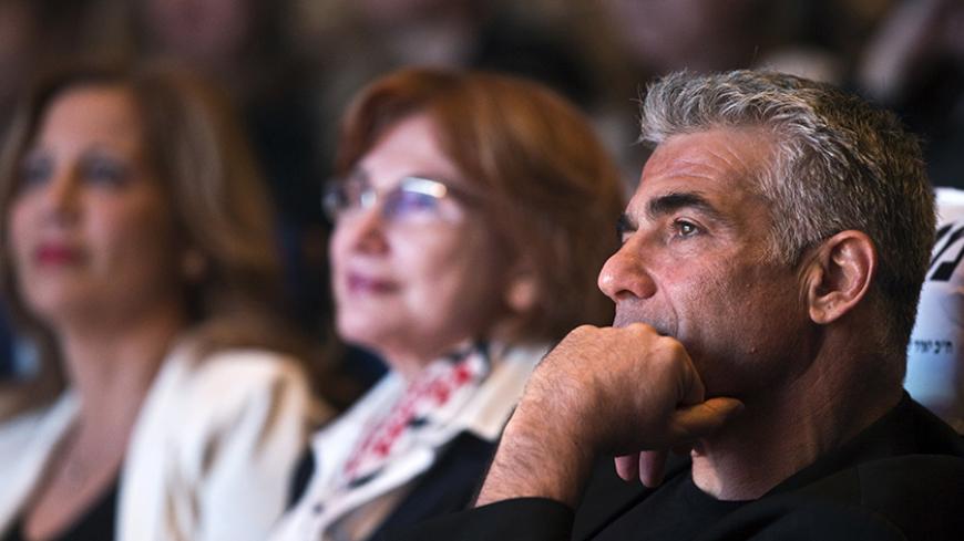 Yesh Atid leader Yair Lapid attends a women's committee convention in Tel Aviv March 1, 2015. The era of Prime Minister Benjamin Netanyahu is ending, with Israeli voters clearly more concerned about economic and social issues than about security or fears over Iran, a leading election candidate said on Monday. Lapid, a telegenic former news anchor and TV host, leads the centrist, secular Yesh Atid party ("There's a Future"), which emerged out of the cost-of-living protests that swept Israel in 2011. Picture