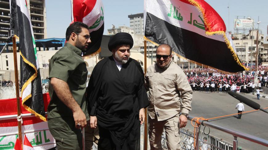 Iraqi Shi'ite cleric Moqtada al-Sadr (C) is seen during a protest against corruption at Tahrir Square in Baghdad, July 15, 2016.  REUTERS/Alaa Al-Marjani  - RTSI25C