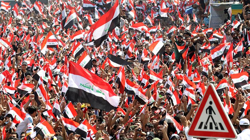 Supporters of Iraqi Shi'ite cleric Moqtada al-Sadr shout slogans during a protest against corruption at Tahrir Square in Baghdad, July 15, 2016.  REUTERS/Alaa Al-Marjani  - RTSI28Z