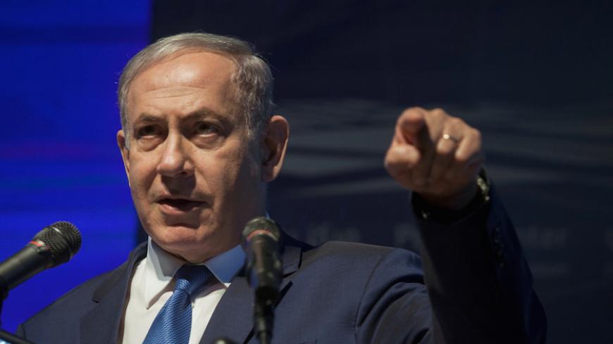 Israeli Prime Minister Benjamin Netanyahu gestures as he speaks during a ceremony at the Peres Center for Peace in Jaffa, Israel, July 21, 2016. REUTERS/POOL/Dan Balilty - RTSJ1NL