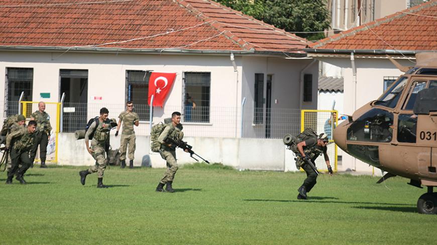 Turkish commandos take part in an operation to search for missing military personnel suspected of being involved in the coup attempt, in Marmaris, Turkey, July 22, 2016. REUTERS/Kenan Gurbuz - RTSJ80F