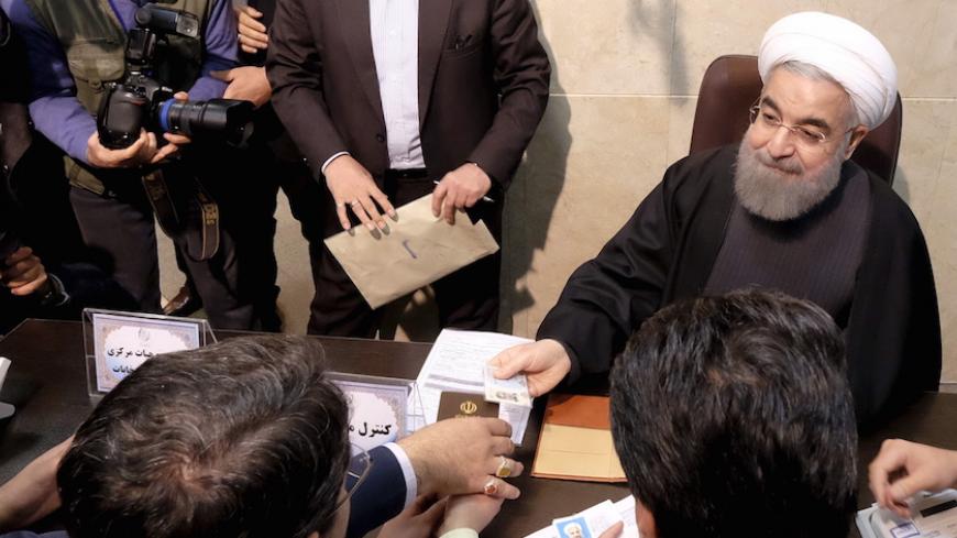 Iranian President Hassan Rouhani registers for February's election of the Assembly of Experts, the clerical body that chooses the supreme leader, at the Interior Ministry in Tehran December 21, 2015. REUTERS/Raheb Homavandi/TIMA ATTENTION EDITORS - THIS IMAGE WAS PROVIDED BY A THIRD PARTY. FOR EDITORIAL USE ONLY. - RTX1ZKNX