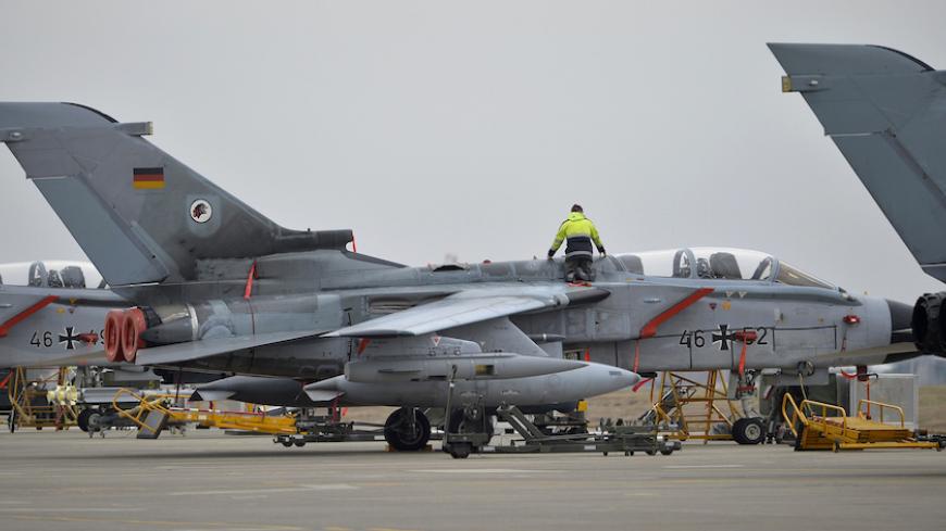 A technician works on a German Tornado jet at the air base in Incirlik, Turkey, January 21, 2016. REUTERS/Tobias Schwarz/Pool - RTX23F6S
