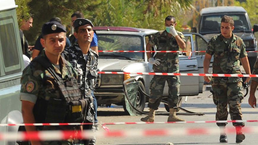 Lebanese army soldiers and policemen secure the area at the site where suicide bomb attacks took place in the Christian village of Qaa, in the Bekaa valley, Lebanon June 27, 2016. REUTERS/Hassan Abdallah - RTX2IE68