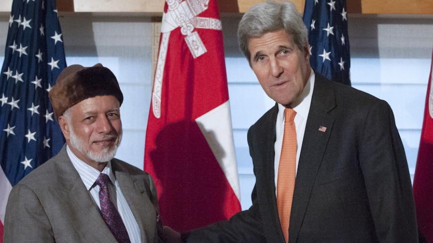 United States Secretary of State John Kerry (R) shakes hands with Foreign Minister Yusuf bin Alawi bin Abdullah of Oman as they pose for photos at the Palace Hotel in New York, October 2, 2015. REUTERS/Stephanie Keith - RTS2SXQ
