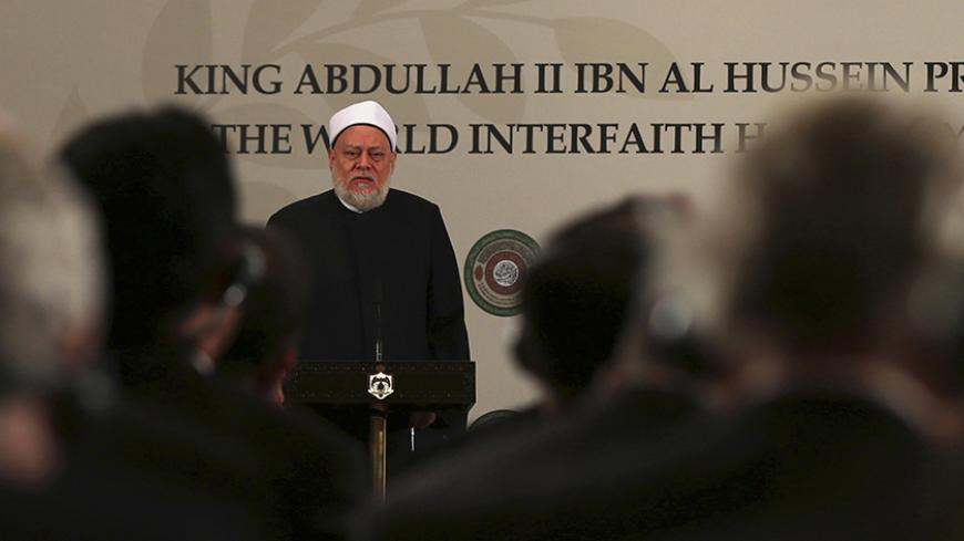 Egypt's former Grand Mufti Ali Gomaa speaks during the King Abdullah II World Interfaith Harmony Week prize ceremony at the Royal Palace in Amman April 27, 2014. The World Interfaith Harmony Week was first proposed at the United Nations' General Assembly on September 23, 2010 by Jordan's King Abdullah to promote global religious harmony and was subsequently unanimously adopted by the UN. REUTERS/Muhammad Hamed (JORDAN - Tags: POLITICS RELIGION) - RTR3MTUP