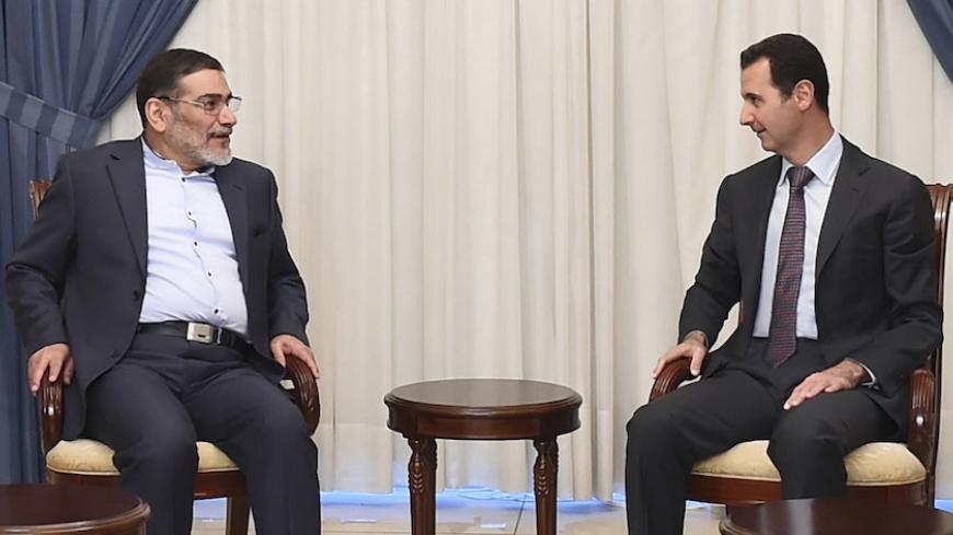Syria's President Bashar al-Assad (R) meets Admiral Ali Shamkhani, Iran?s Supreme National Security Council Director, in Damascus September 30, 2014,in this picture released by Syria's national news agency SANA. REUTERS/SANA/Handout via Reuters (SYRIA - Tags: POLITICS) ATTENTION EDITORS - THIS PICTURE WAS PROVIDED BY A THIRD PARTY. REUTERS IS UNABLE TO INDEPENDENTLY VERIFY THE AUTHENTICITY, CONTENT, LOCATION OR DATE OF THIS IMAGE. FOR EDITORIAL USE ONLY. NOT FOR SALE FOR MARKETING OR ADVERTISING CAMPAIGNS. 