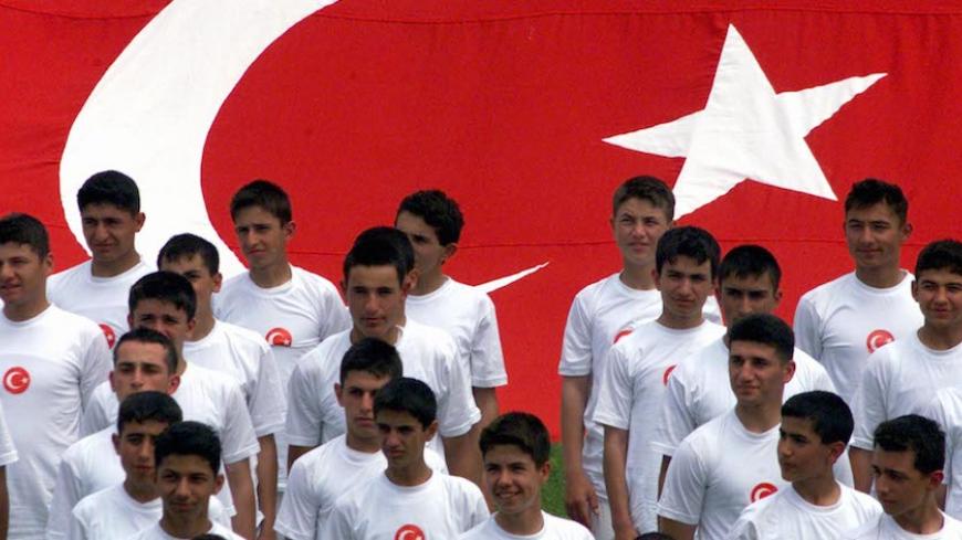Students of Turkish military high school of Kuleli stand before a Turkish flag during their performance in Inonu Stadium May 19, 2001, to celebrate Youth and Sports Day. Turkey is celebrating Youth and Sports Day with parades by students and military throughout the country.
FS/WS - RTRIHY6