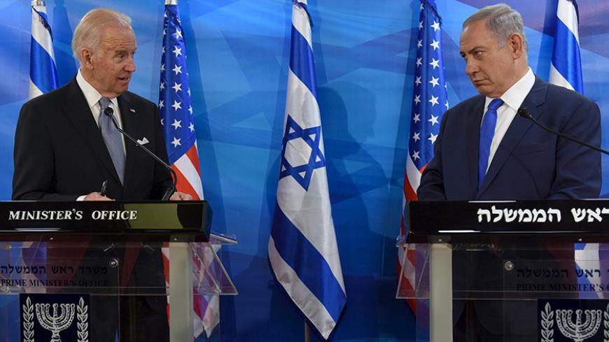 U.S. Vice President Joe Biden (L) and Israeli Prime Minister Benjamin Netanyahu look at each other as they deliver joint statements during their meeting in Jerusalem March 9, 2016. REUTERS/Debbie Hill/Pool      TPX IMAGES OF THE DAY      - RTS9ZRL
