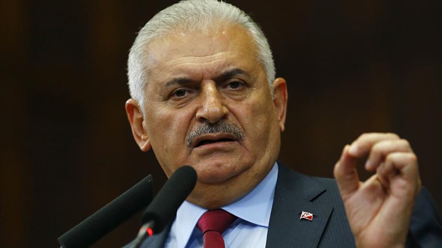 Turkey's Prime Minister Binali Yildrim addresses members of parliament from his ruling AK Party (AKP) during a meeting at the Turkish parliament in Ankara, Turkey July 19, 2016.    REUTERS/Umit Bektas  - RTSINN0