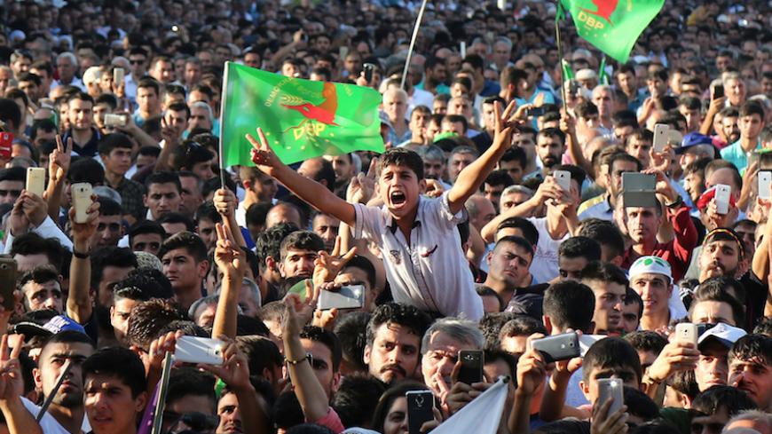 People gather on a main square of Kurdish-dominated city of Diyarbakir during the "No to Coup! Democracy Now Rally" organised by pro-Kurdish opposition Peoples' Democratic Party (HDP), Turkey, July 31, 2016. REUTERS/Sertac Kayar  - RTSKGUU