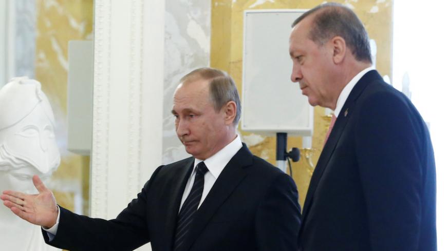 Russian President Vladimir Putin leads the way for Turkish President Tayyip Erdogan during a news conference following their meeting in St. Petersburg, Russia, August 9, 2016.  REUTERS/Sergei Karpukhin - RTSM3BJ