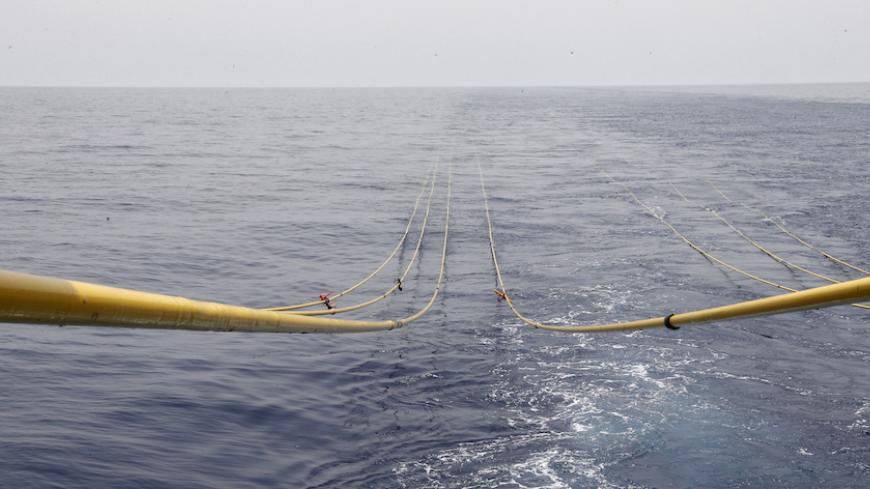 The cables of a side-scan sonar is seen in the waters of the Mediterranean sea, during a tour of areas believed to have gas reserves, off Lebanon's coast near Beirut May 30, 2013. Offshore seismic surveys suggest Lebanon has at least 30 trillion cubic feet in just a small fraction of its Mediterranean waters Energy Minister Gebran Bassil said. Lebanon has selected 46 international oil companies to bid to explore for gas off its coast, where survey ships have been assessing prospects after discoveries in wat
