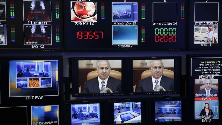 Israel's Prime Minister Benjamin Netanyahu is seen on monitors before the evening news bulletin at Channel 10's control room in Jerusalem November 18, 2015. Critics say Netanyahu, known as "Bibi," is hitting the wrong note when it comes to the media, weakening press freedom and holding sway over TV broadcasters in a country that bills itself as the Middle East's only true democracy. Picture taken November 18, 2015. To match Insight ISRAEL-NETANYAHU/MEDIA REUTERS/Ronen Zvulun - RTX1VG1F