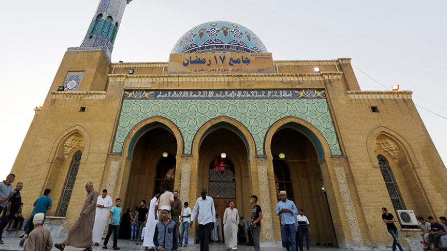 Sunni Muslims attend prayers at a mosque, during Eid al-Fitr as they mark the end of the fasting month of Ramadan, in Baghdad, Iraq July 6, 2016. REUTERS/Ahmed Saad - RTX2JW80