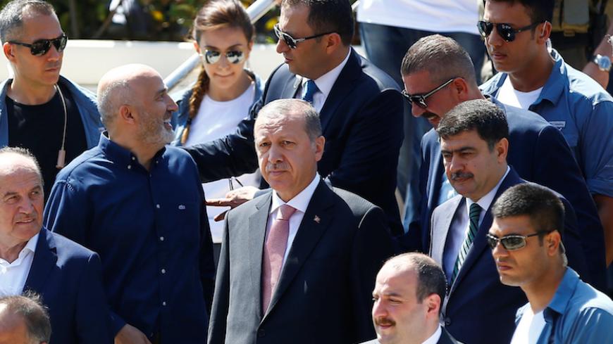 Turkish President Tayyip Erdogan (C) leaves from a mosque after Friday prayers in Istanbul, Turkey August 19, 2016. REUTERS/Osman Orsal - RTX2M0SQ
