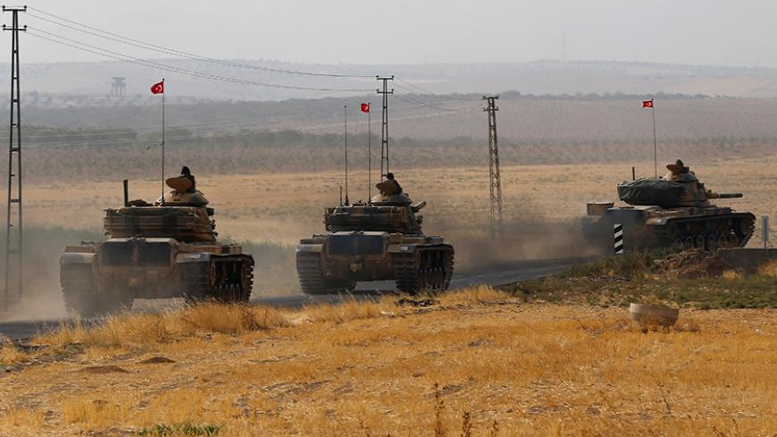Turkish army tanks drive towards to the border in Karkamis on the Turkish-Syrian border in the southeastern Gaziantep province, Turkey, August 25, 2016. REUTERS/Umit Bektas - RTX2MYJC