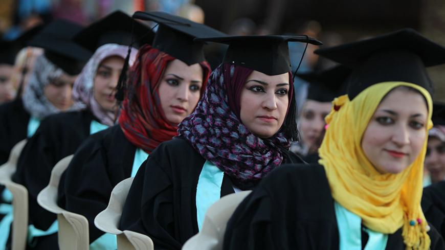 Iraqi students attend their graduation ceremony at Technical University of Baghdad on June 30, 2012 to celebrate receiving their degrees for the first time since the US-led war on Iraq in 2003. The ceremonies were officially stopped by authorities due to the security issues after several attacks and explosions took place at the university since the ousting of former president, Saddam Hussein in 2003. AFP PHOTO/AHMAD AL-RUBAYE        (Photo credit should read AHMAD AL-RUBAYE/AFP/GettyImages)