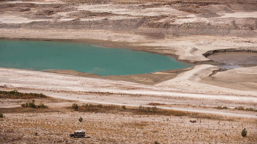 A picture taken on September 17, 2014 shows a partial view of Lar dam's reservoir located some 70 kms northeast of the capital Tehran, at the foot of Damavand mountain, in the town of Damavand. The Iranian authorities have warned and urged the people of Tehran to drastically reduce their water consumption, as three of the five dams supplying the capital are almost empty.  AFP PHOTO/ISNA/HAMIDREZA DASJJERDI        (Photo credit should read HAMIDREZA DASTJERDI/AFP/Getty Images)