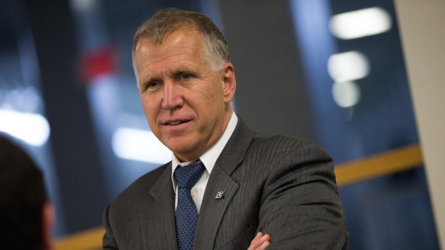 WASHINGTON, DC - MAY 9: Sen. Thom Tillis (R-NC) speaks with an aide after a vote at the U.S. Capitol, May 9, 2016, in Washington, DC. Senate Democrats defeated a procedural vote on an energy bill, which increases funding for the Department of Energy and Army Corps of Engineers. (Photo by Drew Angerer/Getty Images)